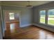 Bright bedroom with hardwood floors and an abundance of natural light from multiple windows at 1704 16Th Ne St, Hickory, NC 28601