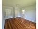 Bedroom with hardwood floors, closet, and bathroom access at 1704 16Th Ne St, Hickory, NC 28601