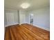 Spacious bedroom featuring hardwood floors and neutral paint, offering a serene atmosphere at 1704 16Th Ne St, Hickory, NC 28601