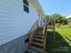 Close-up of a newly constructed wooden deck and steps, offering backyard access at 1704 16Th Ne St, Hickory, NC 28601