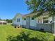 View of home's side and front porch with white pillars, showing exterior details and yard at 1704 16Th Ne St, Hickory, NC 28601