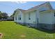 Side view of home featuring a white exterior, well-maintained lawn, and a visible 'For Sale' sign at 1704 16Th Ne St, Hickory, NC 28601