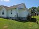 Exterior view of the home, including a wooden deck and stairs leading to the backyard at 1704 16Th Ne St, Hickory, NC 28601