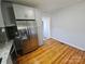 Modern kitchen with stainless steel refrigerator, gray cabinets and granite countertops at 1704 16Th Ne St, Hickory, NC 28601