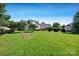 Extensive backyard with established landscaping and trees at 2117 Copperplate Rd, Charlotte, NC 28262