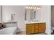 Bathroom features double sink vanity, bathtub, and neutral color palette at 2117 Copperplate Rd, Charlotte, NC 28262