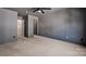 Bedroom with modern gray walls, carpet flooring, and ensuite bath access at 2117 Copperplate Rd, Charlotte, NC 28262