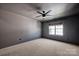 Neutral bedroom featuring a ceiling fan and a window providing natural light at 2117 Copperplate Rd, Charlotte, NC 28262