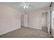Bedroom features carpet, fan, neutral walls, and walk in closet at 2117 Copperplate Rd, Charlotte, NC 28262
