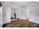 Dining room with hardwood floors, wainscoting, and a view of the staircase at 2117 Copperplate Rd, Charlotte, NC 28262