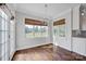 Bright dining area with natural light from large windows and gleaming hardwood floors at 2117 Copperplate Rd, Charlotte, NC 28262