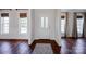 Bright foyer with hardwood floors, a patterned rug, and a view of large windows at 2117 Copperplate Rd, Charlotte, NC 28262