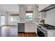 Bright kitchen with a stainless steel dishwasher, a gas range, and a sink under a window at 2117 Copperplate Rd, Charlotte, NC 28262