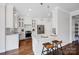 Bright kitchen with white cabinets, stainless steel appliances, and hardwood floors at 2117 Copperplate Rd, Charlotte, NC 28262