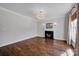 Spacious living room featuring a cozy fireplace, hardwood floors, and ample natural light at 2117 Copperplate Rd, Charlotte, NC 28262