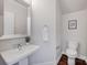 Stylish powder room featuring a pedestal sink, modern fixtures, and tasteful decor at 2117 Copperplate Rd, Charlotte, NC 28262