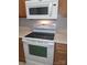 Modern white kitchen appliances, including a range and microwave, offering convenience at 2150 Winthrop Chase Dr, Charlotte, NC 28212