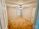 This bedroom offers neutral walls, carpeted floors, a ceiling fan, and a window for natural light at 2150 Winthrop Chase Dr, Charlotte, NC 28212