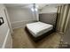 Bedroom featuring carpet, ceiling fan and a decorative headboard at 2150 Winthrop Chase Dr, Charlotte, NC 28212