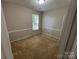 Bedroom showcasing carpet and natural light at 2150 Winthrop Chase Dr, Charlotte, NC 28212