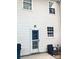 Back exterior elevation featuring a door, windows, patio and an outdoor chair at 2150 Winthrop Chase Dr, Charlotte, NC 28212