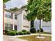 Charming two-story home features a front-entry garage, well-maintained landscaping, and a mature tree in the yard at 2150 Winthrop Chase Dr, Charlotte, NC 28212