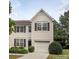 Charming two-story home with a well-maintained lawn and attached garage at 2150 Winthrop Chase Dr, Charlotte, NC 28212