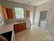 The kitchen offers ample counter space and features a dishwasher, laundry area, and an exterior door for convenience at 2150 Winthrop Chase Dr, Charlotte, NC 28212
