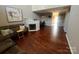 Inviting living room with hardwood floors, fireplace, and comfortable seating at 2150 Winthrop Chase Dr, Charlotte, NC 28212