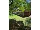 Brick ranch-style home with manicured lawn, featuring light blue shutters and mature tree shade at 2300 Lakeview Cir # 10, Matthews, NC 28105
