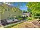 Spacious backyard with patio, fire pit, and lush landscaping perfect for outdoor entertaining at 2926 Royal Fern Ln, Charlotte, NC 28215