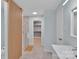 Bright bathroom with a glass shower and a storage closet at 2926 Royal Fern Ln, Charlotte, NC 28215