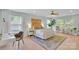 Spacious bedroom with a wooden headboard, a ceiling fan, and lots of natural light at 2926 Royal Fern Ln, Charlotte, NC 28215