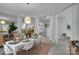 Bright dining room with seating for six, tile floors, plants, and sightlines to other rooms at 2926 Royal Fern Ln, Charlotte, NC 28215