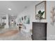 Bright foyer with bench seating, decor, tile floors, and sightlines to other rooms at 2926 Royal Fern Ln, Charlotte, NC 28215