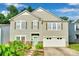 Charming two-story home with a well-maintained front yard and a welcoming light-green front door at 2926 Royal Fern Ln, Charlotte, NC 28215