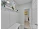 Hallway with bench and access to bathroom at 2926 Royal Fern Ln, Charlotte, NC 28215