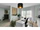 Stylish home office featuring bright light, white furniture, and an area rug on hardwood floors at 2926 Royal Fern Ln, Charlotte, NC 28215