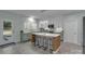 Modern kitchen with white cabinets, quartz counters, and island with seating at 2926 Royal Fern Ln, Charlotte, NC 28215