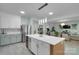 Spacious kitchen with island seating, stainless steel appliances and open to living area at 2926 Royal Fern Ln, Charlotte, NC 28215