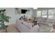 Bright living room with cozy furniture, modern decor, and ample natural light at 2926 Royal Fern Ln, Charlotte, NC 28215