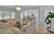 Open-concept floor plan with view from living room into the kitchen and dining area at 2926 Royal Fern Ln, Charlotte, NC 28215