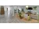 Bright, open living space with comfortable seating, plants, and view into dining area at 2926 Royal Fern Ln, Charlotte, NC 28215