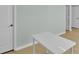 Bright office with light blue walls, light wood-look floors, and a white table at 2926 Royal Fern Ln, Charlotte, NC 28215