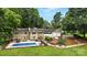 Aerial view of the backyard pool, fire pit, home and garage at 3127 N Center St, Hickory, NC 28601