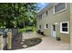 A spacious backyard with a patio, lounge swing, and lush green landscaping at 3127 N Center St, Hickory, NC 28601