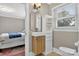 Small bathroom features a modern sink with storage and an elegant light fixture at 3127 N Center St, Hickory, NC 28601