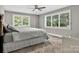 A bedroom with carpet, large windows with tree views, and light-gray walls at 3127 N Center St, Hickory, NC 28601