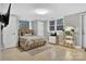 Cozy bedroom featuring a bed, two windows, and indoor plants at 3127 N Center St, Hickory, NC 28601