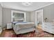 Comfortable bedroom with wood paneling and a window offering natural light at 3127 N Center St, Hickory, NC 28601